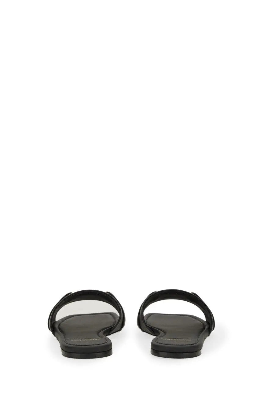 Ferragamo women’s slide sandal in black leather with minimalist design and transparent insole