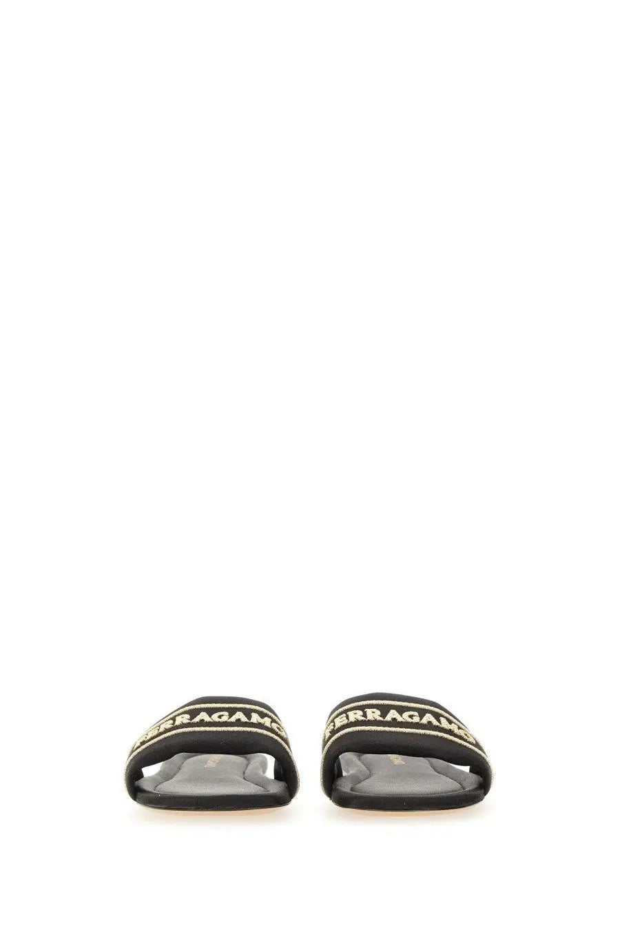 Ferragamo women’s black slide sandal with gold-tone lettering on leather strap for casual wear