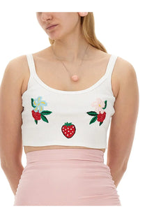 White ribbed cotton crop top with embroidered strawberry and flower motifs paired with fiorucci blue lollipop earrings