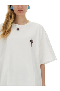 Fiorucci women’s white oversized t-shirt with red and black embroidered lollipop patch on left chest