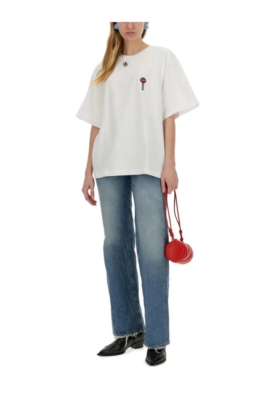 A vibrant red round crossbody bag with a braided strap complementing fiorucci womens lollipop print shirt white