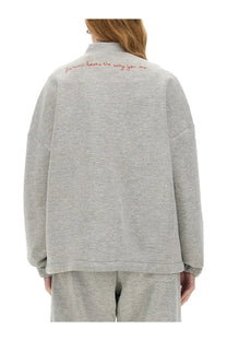 Back view of fiorucci women’s zippered sweatshirt in angel grey with red embroidered text on gray heathered fabric