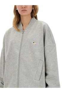 Fiorucci women’s gray heathered zip-up bomber jacket with a small embroidered angel patch on the left chest
