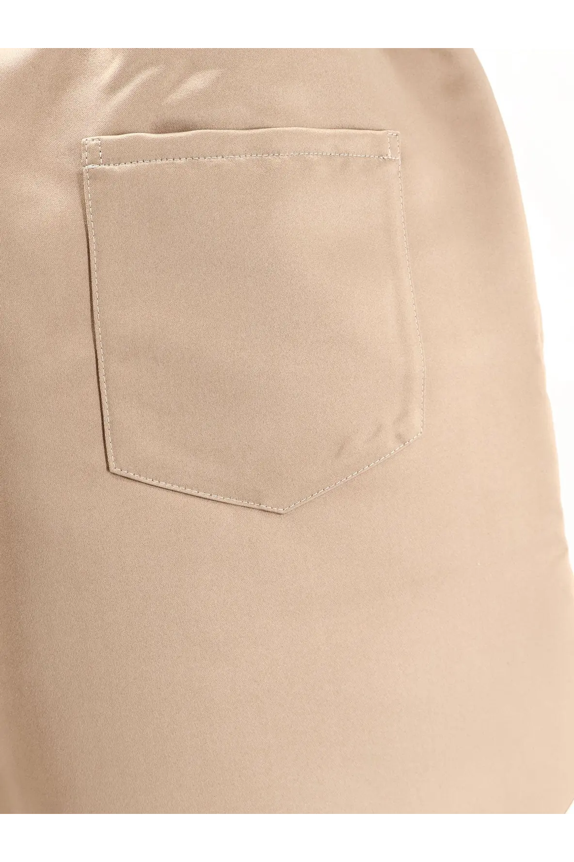 Beige satin boxer shorts from the frankie shop featuring a fabric pocket with matching stitching