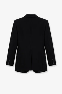 The Frankie Shop women’s Amelia tailored blazer in black features a sleek structured silhouette with button cuff details