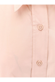 The Frankie Shop women’s Arlen cotton shirt in pale pink features matching buttons and subtle stitching along the placket