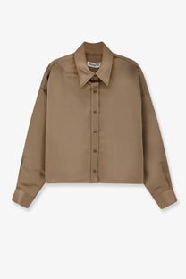 A sleek camel-colored satin button-up shirt with a classic collar and long sleeves from The Frankie Shop