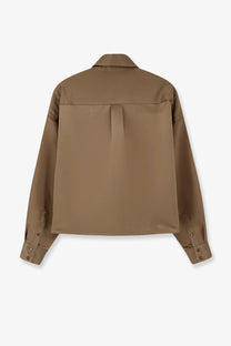 The Frankie Shop women’s arlen satin boxy shirt beige features a camel-colored cotton relaxed fit with buttoned cuffs