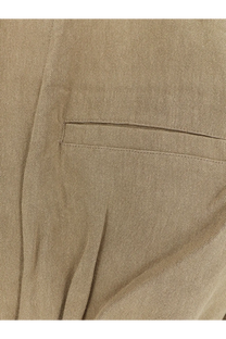 Beige linen textured pocket with subtle stitching on the brown viscose and linen jumpsuit from the frankie shop