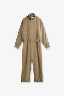 Tan utility jumpsuit with high collar elasticated waistband and cuffs made of viscose and linen by the frankie shop