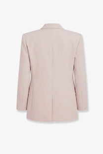 A sleek blush-pink tailored blazer with structured shoulders made of wool blend from The Frankie Shop