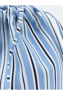 The Frankie Shop women’s Morgan Pochette is a light blue and white striped drawstring bag with navy fabric cord closure