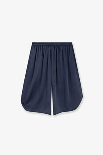 Navy blue silk satin bermuda shorts with elastic waistband and relaxed flowing silhouette from the frankie shop
