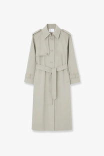 The Frankie Shop women’s riva beige trench coat features a cotton blend fabric, classic collar, shoulder epaulets, and self-tie belt