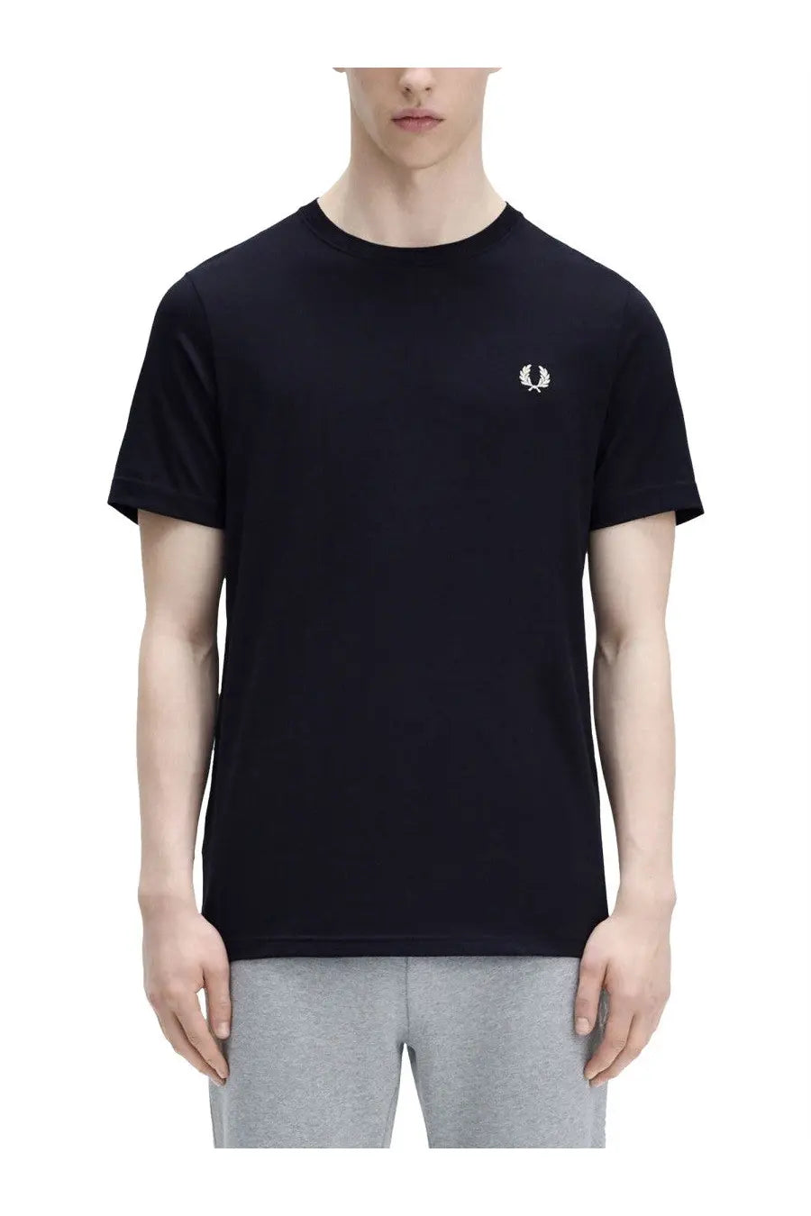 Black fred perry t-shirt with white embroidered laurel wreath logo on left chest in men’s classic blue shirt style