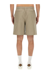 Beige cotton fred perry men’s bermuda shorts with drawstring waistband and logo on the back right pocket