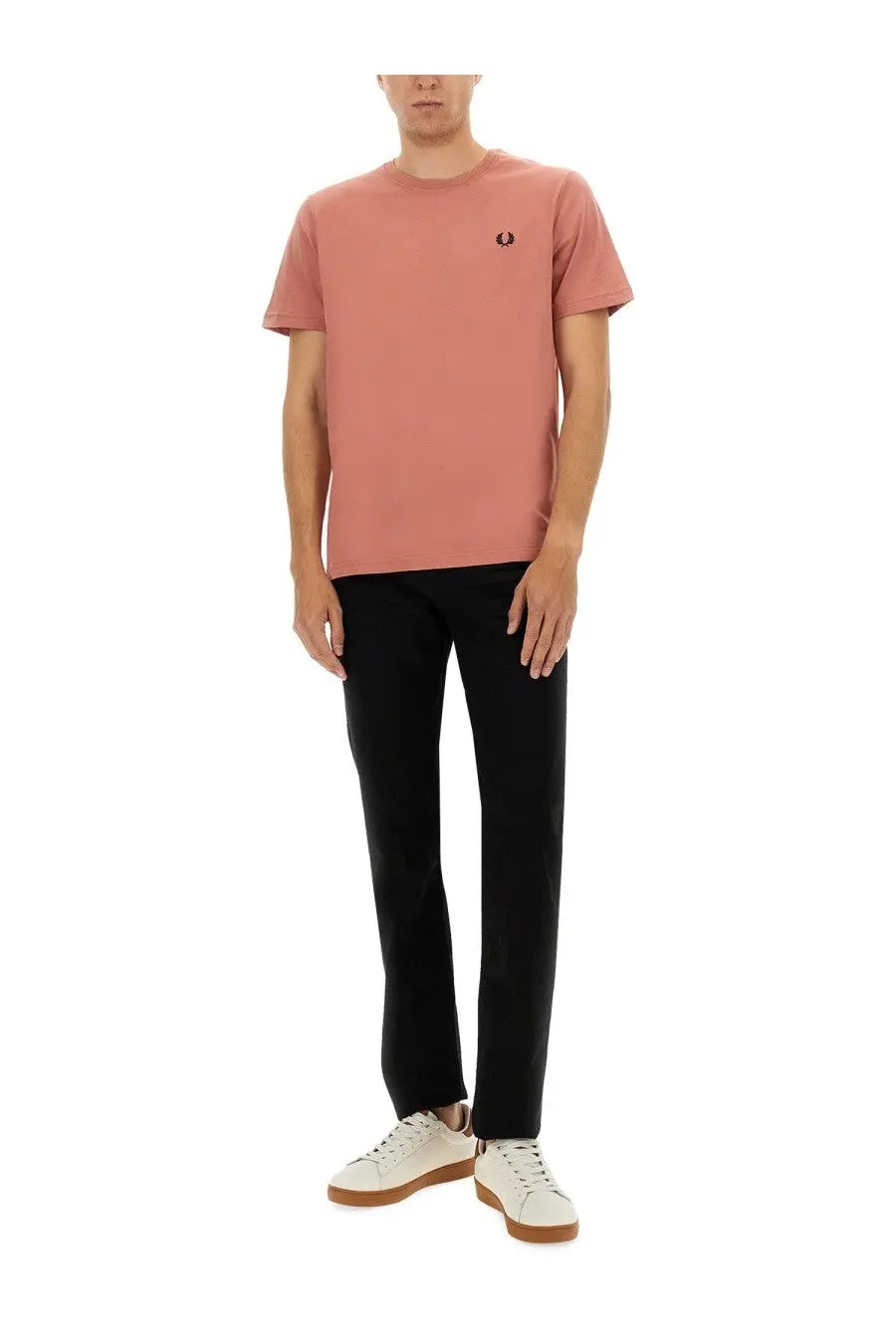 A soft pink fred perry men’s cotton t-shirt with a small black embroidered logo on the left chest