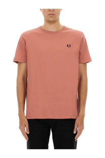 Fred Perry men’s cotton t-shirt in soft rose with a classic round neck and black embroidered laurel wreath logo