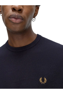 Navy blue knit crew neck sweater with gold embroidered laurel wreath logo from Fred Perry men’s jersey blue collection