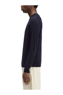 Navy blue Fred Perry men’s long-sleeved knit sweater with subtle logo on the chest in jersey blue material