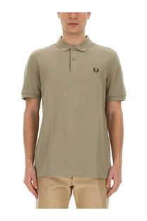 Fred Perry men’s beige polo shirt with classic collar two-button placket and embroidered laurel wreath logo on chest