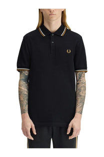 Fred Perry men’s black polo shirt with gold and white trim and embroidered laurel wreath logo on chest