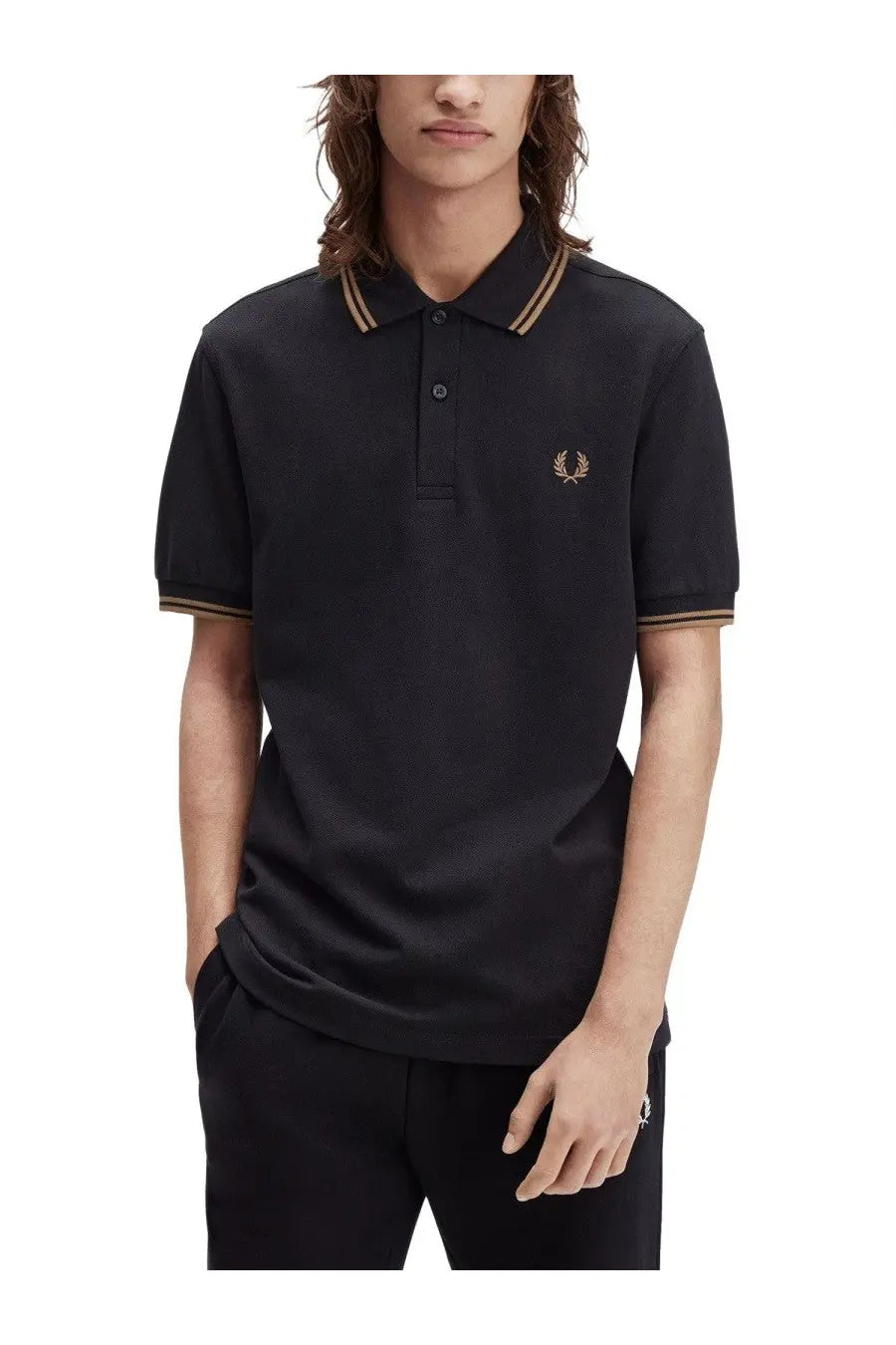 Fred Perry men’s black polo shirt with gold-trimmed collar and cuffs featuring embroidered laurel wreath logo