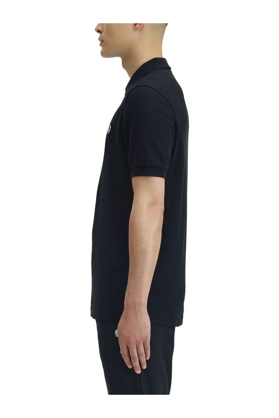 Fred Perry men’s black short-sleeved polo shirt with subtle white logo on chest made from soft breathable cotton