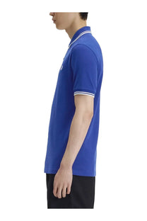 Royal blue Fred Perry men’s polo shirt with white trim on collar and sleeve cuffs for casual wear