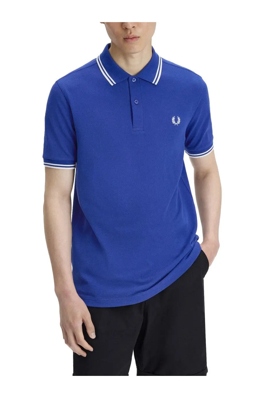 Royal blue Fred Perry men’s polo shirt with white trim and embroidered laurel wreath logo on the chest