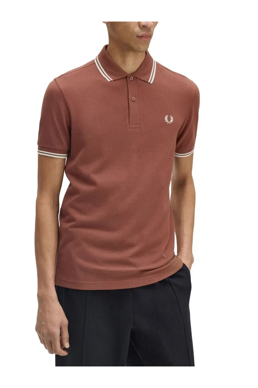 Fred Perry men’s rust-colored polo shirt with white collar and sleeve trim featuring embroidered chest logo