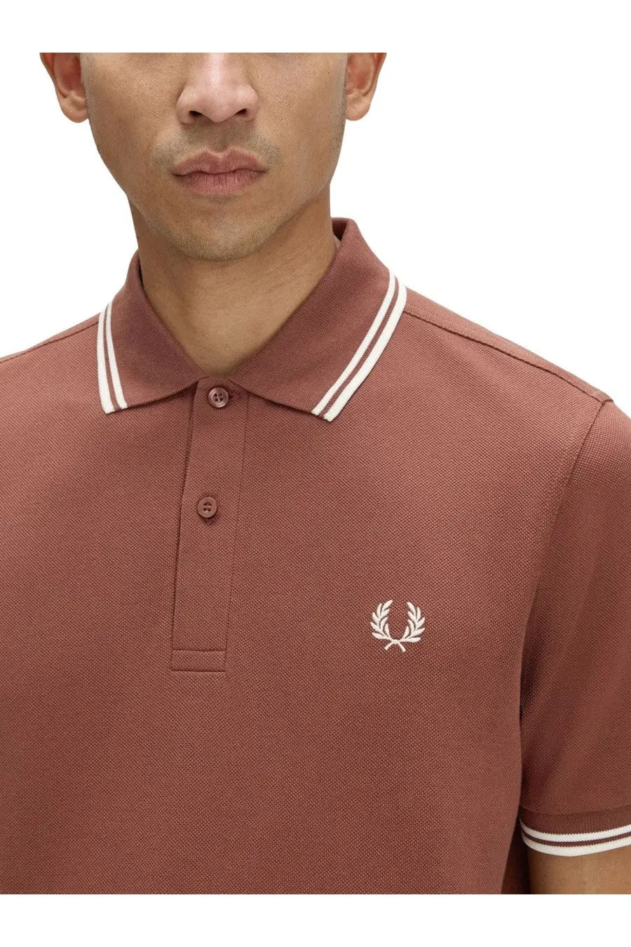 Fred perry men’s brown rust-colored pique polo shirt with white collar trim and embroidered laurel wreath logo