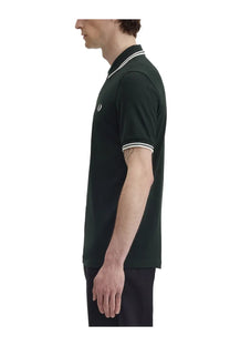 Fred Perry men’s green polo shirt in dark green with white trim on collar and sleeve cuffs for casual wear