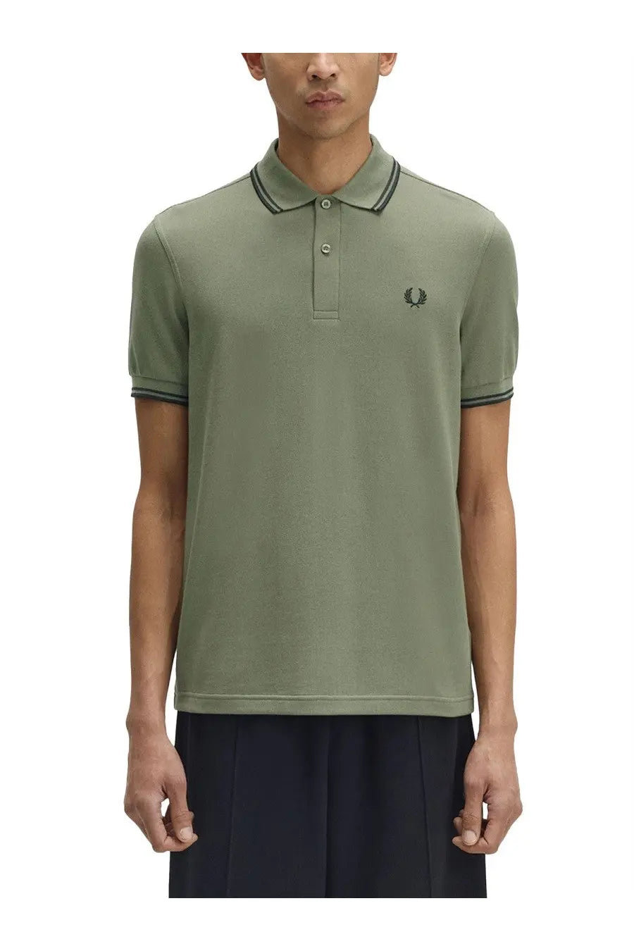 Fred Perry men’s olive green polo shirt with black trim on collar and sleeves featuring a small embroidered logo