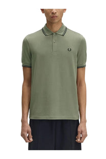 Fred Perry men’s olive green polo shirt with black trim on collar and sleeves featuring a small embroidered logo