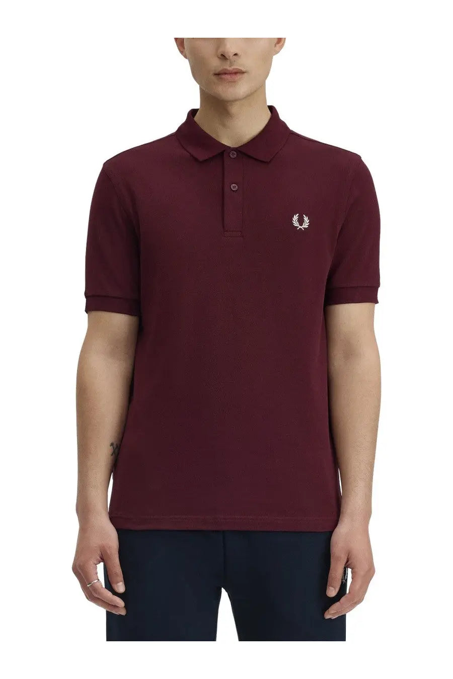 Fred Perry men’s red polo shirt with white embroidered laurel logo on the chest made of cotton blend