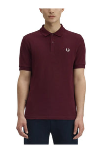 Fred Perry men’s red polo shirt with white embroidered laurel logo on the chest made of cotton blend