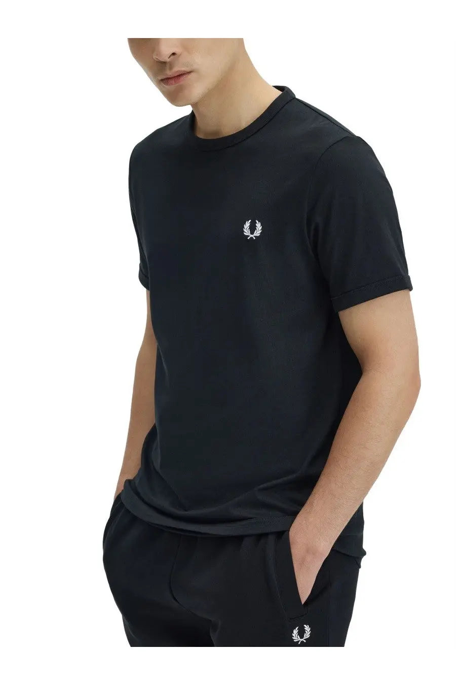 Black fred perry men’s t-shirt featuring a white embroidered laurel wreath logo on the chest in cotton fabric