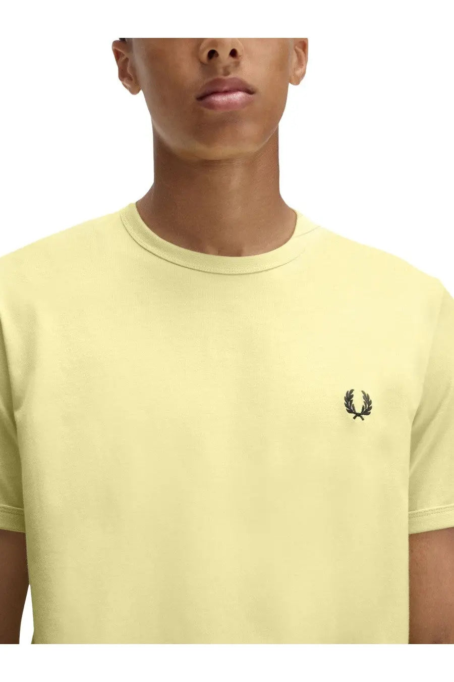 Fred Perry men’s pale yellow t-shirt with black embroidered laurel wreath logo on left chest in ringer style