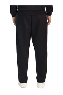 Fred Perry men’s black tapered truck pants with subtle side stripes made from durable material for casual wear