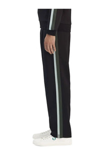 Fred Perry men’s black track pants with vertical white and dark green stripe down the side for casual wear