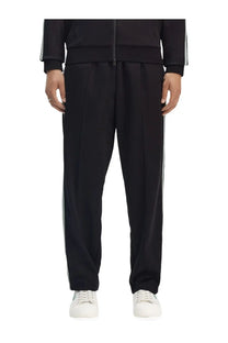 Fred Perry men’s black track pants with white side stripes designed for casual and athletic wear