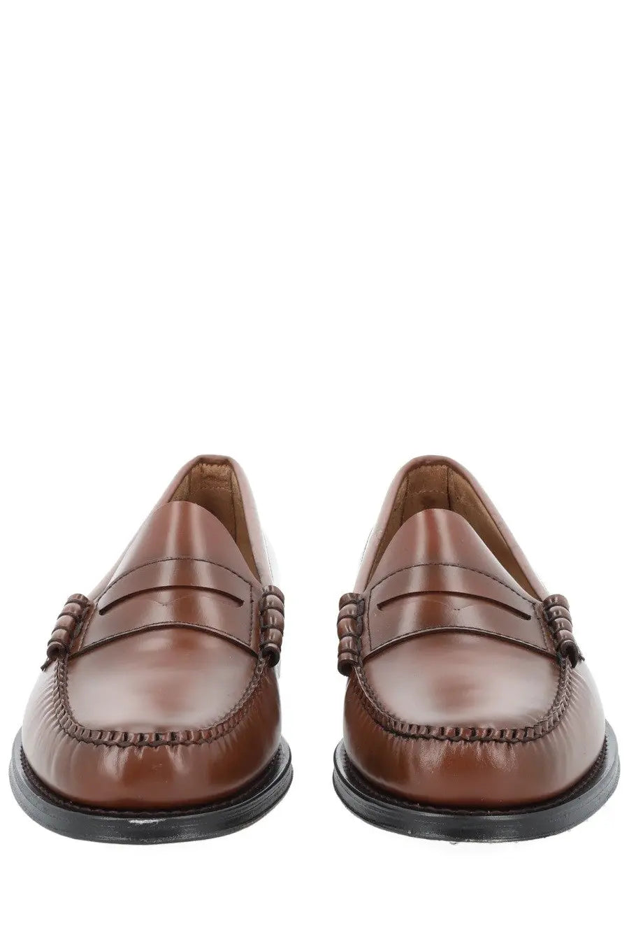 Brown leather loafers by G.H. Bass with classic penny loafer design and black rubber soles for men