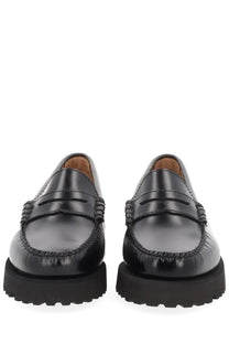 Black patent leather loafers with thick textured rubber sole and decorative stitching g.h. bass women’s moccasin weejuns 90s penny black