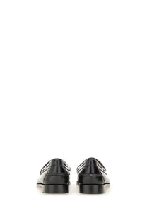 Black patent leather loafers with glossy finish and distinctive logo detailing on the back by G.H. Bass women’s Moccasin Weejuns Esther Kiltie black