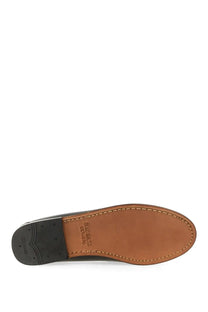 Brown leather sole with black rubber heel and stitched edges of gh bass women’s moccasin weejuns penny black