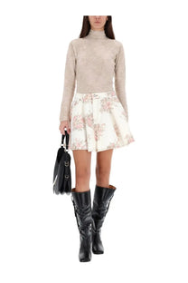 Black leather handbag with structured shape and dual top handles complementing ganni women’s beige alpaca blend sweater