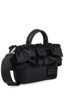 Black ganni women’s tote bag with structured body and ruffled fabric detailing for stylish everyday use