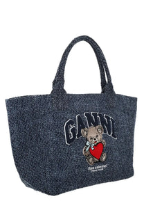 Dark blue textured trapeze tote bag by Ganni with embroidered teddy bear holding red heart and have a nice day text