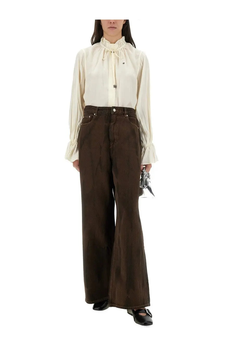 Cream-colored satin blouse with ruffled collar and long sleeves paired with ganni women’s brown baggy pants